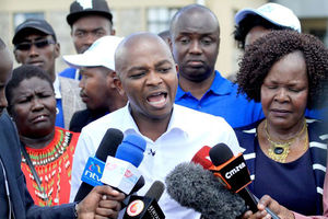 FKF president Nick Mwendwa, flanked by his deputy Doris Petra