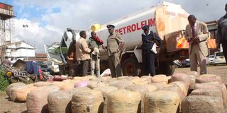 Security officials after they busted an oil tanker along Thika Road that was concealing bhang