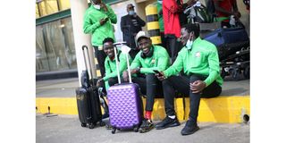 Harambee Stars players Joseph Okumu, Kenneth Muguna and Lawrence Juma at JKIA