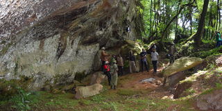 Tourists at one of the many caves inside the Masese Nyangores eco-tourism site.