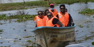 Holidaymakers ride a boat on Lake Naivasha as they celebrate Christmas.