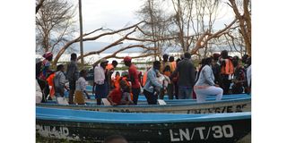 Holidaymakers ride a boat on Lake Naivasha as they celebrate Christmas.