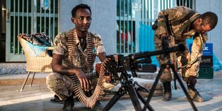 A member of the Amhara Special Forces sits next to a machine gun at an improvised camp in Humera, Ethiopia, in November 2020.