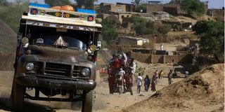 Ethiopian refugees who fled the fighting in the Tigray region head to a reception center in Hamdayit, Sudan, in November 2020.