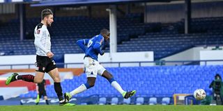 Everton midfielder Abdoulaye Doucoure (right) scores