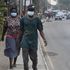 People walk along a main road in Lagos, Nigeria in 2020.