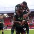 Tottenham Hotspur midfielder Tanguy Ndombele (front) celebrates