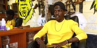 Alex Muturi at his barber shop