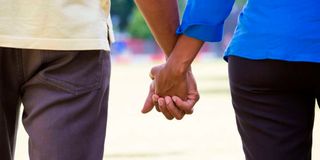 Couple holding hands