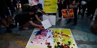 Protesters hold a vigil