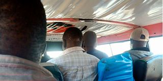 Passengers in a crowded matatu 