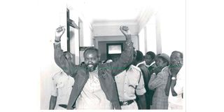 Maina Kinyatti being led to cells 