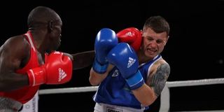 Kenya’s Nick "Commander" Okoth (left) lands a left hook against Serge Kishko from Ukraine