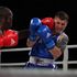 Kenya’s Nick "Commander" Okoth (left) lands a left hook against Serge Kishko from Ukraine
