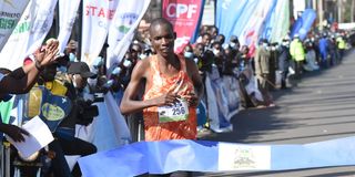 Victor Kipchirchir crosses the finish line to win the Eldoret City Marathon men's race