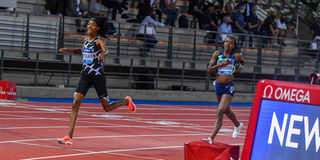 Netherlands' Sifan Hassan (left) crosses the finish line ahead of Kenya's Faith Chpeng'etich