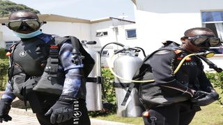 Divers Keneth Rotich (left) and Gideon Ngotwa