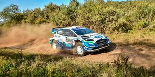 British driver Gus Greensmith drives his Ford Fiesta WRC.