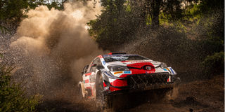 British driver Evans steers his Toyota Yaris WRC with British co-driver Martin