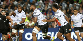 Mesulame Kunavula of Fiji runs with the ball