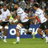 Mesulame Kunavula of Fiji runs with the ball
