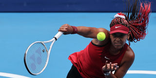Japan's Naomi Osaka serves to Switzerland's Viktorija Golubic