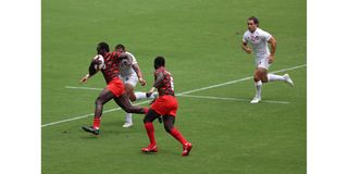 Kenya's Billy Odhiambo sprints to the try line