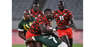 Kenya's Nelson Oyoo (left) is tackled by South Africa's Branco du Preez