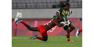 Kenya's Willy Ambaka (left) tackles South Africa's Branco du Preez 