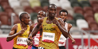 Uganda's Joshua Cheptegei crosses the finish line