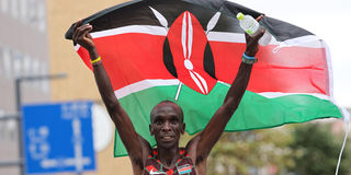 Kenya's Eliud Kipchoge celebrates after winning the men's marathon final