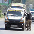 A matatu picking passengers. 