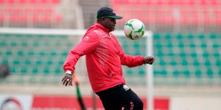 Kenya's Harambee Stars head coach Jacob "Ghost" Mulee juggles a ball