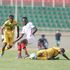 Kenya's midfielder Duke Abuya vies for the ball with Kouame Rominigue and Diadie Samassekou