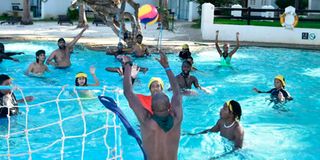 Local tourists play water polo game