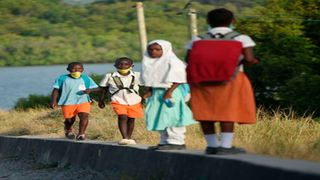 Children returning home from school.