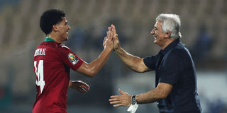 Morocco's forward Zakaria Aboukhlal (left) celebrates with head coach Vahid Halilhodzic