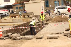 Workers building pedestrian walkways Nakuru CBD,