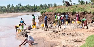 Residents fetch water by the banks of Sabaki River in Kilifi County.