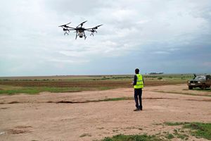 Technician using a drone