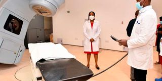 KUTRH radiation therapist technician Bradley Ahaza operating a Linac Accelerator machine.