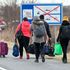 Ukrainian refugees cross the border by foot in Baraba