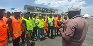 WRC Safari Rally and ARC Equator Rally Service Park Manager Joe Muchiri (right) briefs his staff