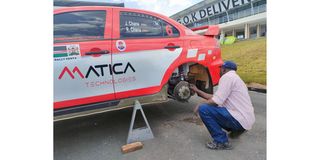 Team member David Boro has a look at the rear suspension of the Mistubishi Lancer Evo X of Chana brothers