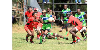 KCB scrum-half Michael Wanjala charges past Impala's defence