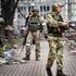 Russian soldiers in a street in Mariupol