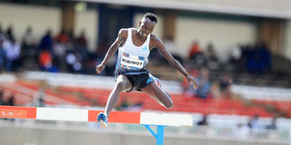 Abraham Kibiwott clears a hurdle in the men's 3,000m steeplechase race 