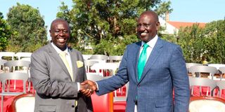 DP William Ruto shakes hands with his running mate, Mr Rigathi Gachagua