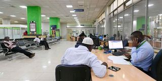 A customer being served at a KCB bank in Nairobi. 