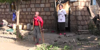 David Muthee walks using crutches